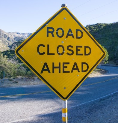 Road warning sign saying Road closed ahead